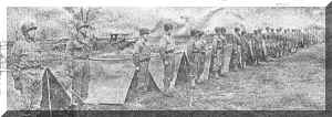 Enlisted men in the Austrian Battalion at Camp Atterbury receive the same training program given all soldiers at the army camp.  In the two photographs above, members of Company A are shown setting up pup tents and standing at attention after they had completed their task.