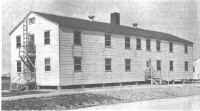 Comfortable, home-like rooms are provided for the girls in the "Telephone Operators' Quarters," the only civilian barracks on the reservation.