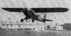 1st Lt. C. W. Lauman, 592nd F. A.; 2nd Lt. F. G. Josten, of Division Artillery Hq., and S/Sgt Jack Gray, 590th F. A. Bn. S/Sgt Gray is shown taking off in one of the flying jeeps.