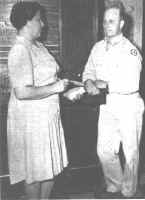 Chief Operator Frances White and Capt. Taylor C. Smith, Post Signal Officer, discuss a service problem.