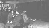 General view of the telephone room at Camp Atterbury.  Soldiers in the foreground are waiting for calls to be completed.
